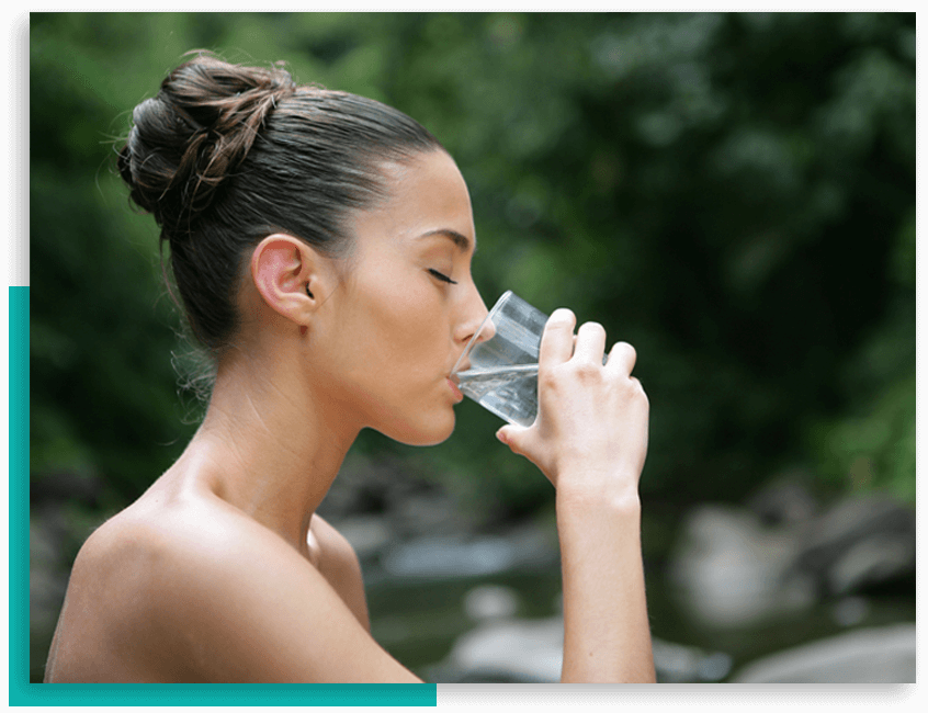 woman drinking filtered water
